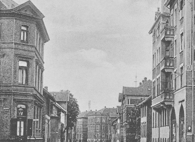Eine Straßenecke in Braunschweig auf einer schwarz-weiß-Postkarte.