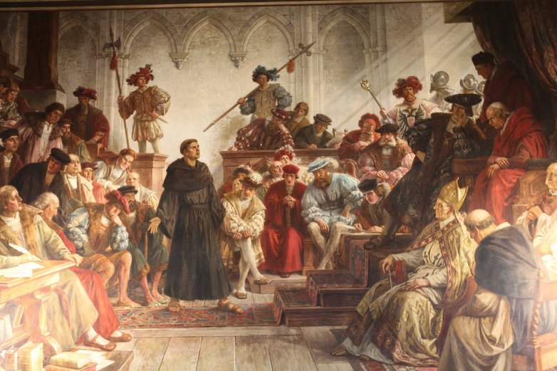 Bild, welches Martin Luther vor dem Wormser Reichstag zeigt.